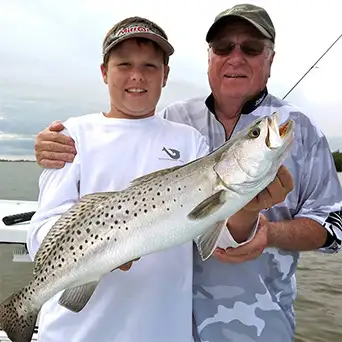 Son and father with a Gator Trout in Fort Pierce